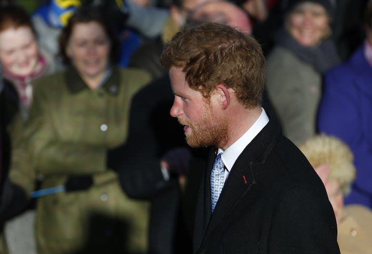 Britain's Prince Harry walks to a Christmas Day morning service at the church on the Sandringham Estate in Norfolk, eastern England, December 25, 2013. REUTERS/Andrew Winning  (BRITAIN - Tags: ROYALS RELIGION) - RTX16TQA